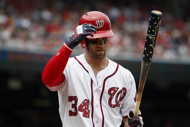 Washington Nationals right fielder Bryce Harper (34) bats with a patriotic themed bat with stars, stripes, and a Washington skyline, during a baseball game against the San Francisco Giants at Nationals Park, Saturday, July 4, 2015, in Washington. The Nationals won 9-3. (AP Photo/Alex Brandon)
