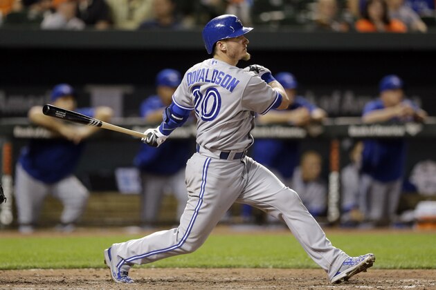 Toronto Blue Jays' Josh Donaldson watches his single during the seventh inning of a baseball game against the Baltimore Orioles, Tuesday, May 12, 2015, in Baltimore. Devon Travis scored on the play. Toronto won 10-2. (AP Photo/Patrick Semansky)