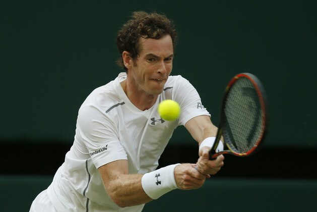 Andy Murray of Britain returns to Andreas Seppi of Italy during their singles match against at the All England Lawn Tennis Championships in Wimbledon, London, Saturday July 4, 2015. (AP Photo/Alastair Grant)