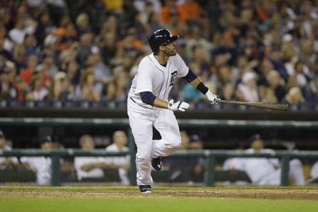 Detroit Tigers' J.D. Martinez watches his two-run home run during the eighth inning of a baseball game against the Pittsburgh Pirates, Tuesday, June 30, 2015, in Detroit. (AP Photo/Carlos Osorio)