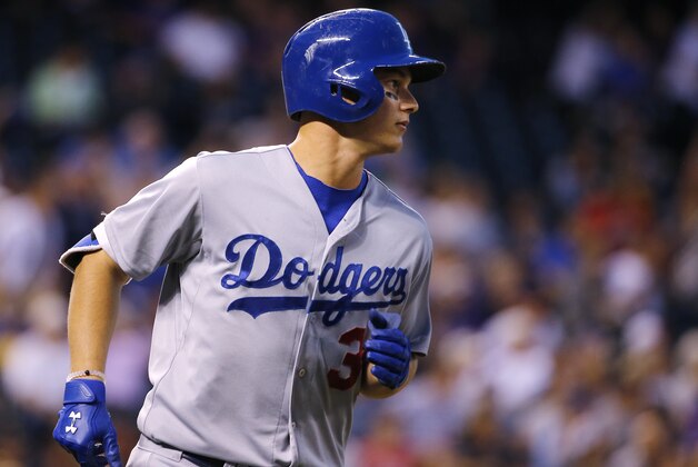 Los Angeles Dodgers' Joc Pederson rounds the bases after hitting a three run home run against the Colorado Rockies during the sixth inning of a baseball game Monday, June 1, 2015, in Denver. (AP Photo/Jack Dempsey)