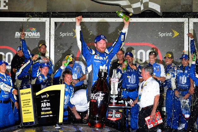 DAYTONA BEACH, FL - JULY 06:  Dale Earnhardt Jr., driver of the #88 Nationwide Stars and Stripes Chevrolet, celebrates in Victory Lane after winning the NASCAR Sprint Cup Series Coke Zero 400 Powered by Coca-Cola at Daytona International Speedway on July 6, 2015 in Daytona Beach, Florida.  (Photo by Robert Laberge/Getty Images)