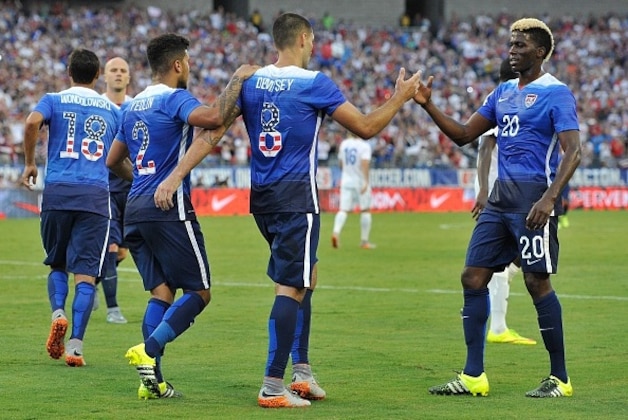 NASHVILLE, TN - JULY 03:  Clint Dempsey #8 of the United States is congratulated by teammates DeAndre Yedlin #2 and Gyasi Zardes #20 after scoring a goal against Guatemala  during the second half of an international friendly soccer match between at Nissan Stadium  on July 3, 2015 in Nashville, Tennessee.  (Photo by Frederick Breedon/Getty Images)