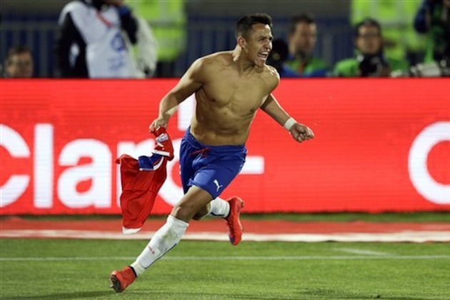 Chile's Alexis Sanchez celebrates after scoring the winning penalty kick against Argentina during the Copa America final soccer match at the National Stadium in Santiago, Chile, Saturday, July 4, 2015. Chile became Copa America champions for the first time after it defeated Argentina in a penalty shootout. (AP Photo/Ricardo Mazalan)