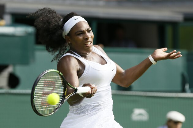 Serena Williams of the United States makes a return to Heather Watson of Britain, during their singles match at the All England Lawn Tennis Championships in Wimbledon, London, Friday July 3, 2015. (AP Photo/Kirsty Wigglesworth)
