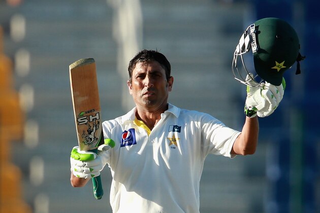 ABU DHABI, UNITED ARAB EMIRATES - NOVEMBER 10:  Younis Khan of Pakistan acknowledges the crowd after reaching his century during day two of the first test between Pakistan and New Zealand at Sheikh Zayed stadium on November 10, 2014 in Abu Dhabi, United Arab Emirates.  (Photo by Warren Little/Getty Images)