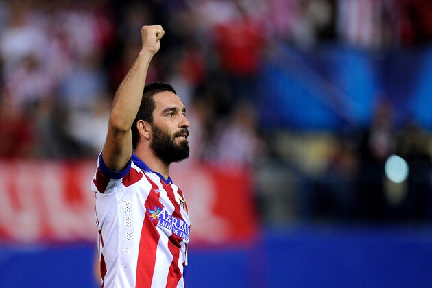 MADRID, SPAIN - OCTOBER 01:  Arda Turan of Club Atletico de Madrid celebrates after scoring his team's opening goal during the UEFA Champions League Group A match between Club Atletico de Madrid and Juventus at Vicente Calderon Stadium on October 1, 2014 in Madrid, Spain.  (Photo by Denis Doyle/Getty Images)