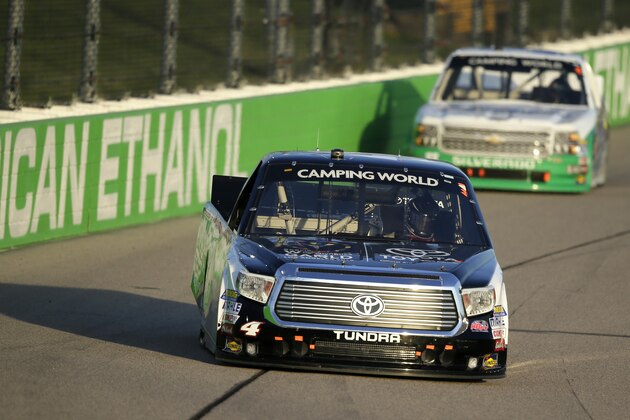 Erik Jones drives ahead of Brandon Jones during the NASCAR Truck Series auto race, Friday, June 19, 2015, at Iowa Speedway in Newton, Iowa. Erik Jones won the race and Brandon Jones finished in second place. (AP Photo/Charlie Neibergall)
