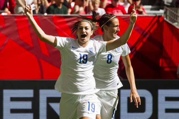 England coach Mark Sampson is picked up by his players after England defeated Germany in the FIFA Women's World Cup third-place soccer match in Edmonton, Alberta, Canada, on Saturday, July 4, 2015. England won 1-0. (Jeff McIntosh/The Canadian Press via AP)