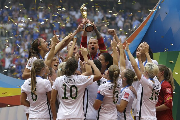 The United States Women's National Team celebrates with the trophy after they beat Japan 5-2 in the FIFA Women's World Cup soccer championship in Vancouver, British Columbia, Canada, Sunday, July 5, 2015. (AP Photo/Elaine Thompson) The United States Women's National Team celebrates with the trophy after they beat Japan 5-2 in the FIFA Women's World Cup soccer championship in Vancouver, British Columbia, Canada, Sunday, July 5, 2015. (AP Photo/Elaine Thompson)