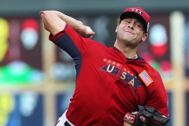 United States' pitcher Lucas Giolito throws a pitch during the fifth inning of the All-Star Futures baseball game against the World Team, Sunday, July 13, 2014, in Minneapolis. (AP Photo/Jim Mone)