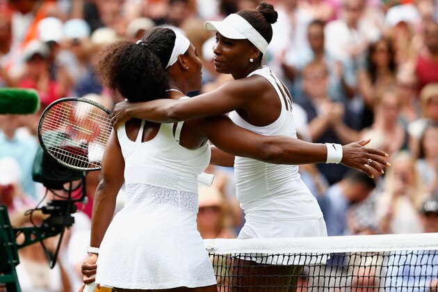 LONDON, ENGLAND - JULY 06:  Serena Williams of the United States hugs Venus Williams of the United States after their Ladies' Singles Fourth Round match  during day seven of the Wimbledon Lawn Tennis Championships at the All England Lawn Tennis and Croquet Club on July 6, 2015 in London, England.  (Photo by Julian Finney/Getty Images)