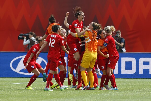 EDMONTON, AB - JULY 4: Team members from England celebrate after their goal during the FIFA Women's World Cup Canada 3rd Place Play-off match between England and Germany at Commonwealth Stadium on July 4, 2015 in Edmonton, Alberta, Canada.  (Photo by Todd Korol/Getty Images)