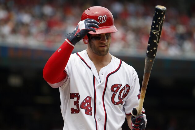 Washington Nationals right fielder Bryce Harper (34) bats with a patriotic themed bat with stars, stripes, and a Washington skyline, during a baseball game against the San Francisco Giants at Nationals Park, Saturday, July 4, 2015, in Washington. The Nationals won 9-3. (AP Photo/Alex Brandon)