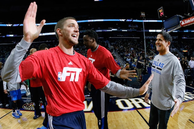 Dallas Mavericks forward Chandler Parsons high-fives owner Mark Cuban before an NBA basketball game, Sunday, Jan. 25, 2015, in New Orleans. (AP Photo/Jonathan Bachman)