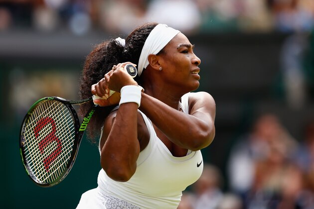 LONDON, ENGLAND - JULY 06:  Serena Williams of the United States plays a backhand in her Ladies' Singles Fourth Round match against Venus Williams of the United States during day seven of the Wimbledon Lawn Tennis Championships at the All England Lawn Tennis and Croquet Club on July 6, 2015 in London, England.  (Photo by Julian Finney/Getty Images)