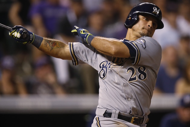Milwaukee Brewers left fielder Gerardo Parra bats against the Colorado Rockies in the seventh inning of a baseball game Friday, June 19, 2015, in Denver. Milwaukee won 9-5. (AP Photo/David Zalubowski)