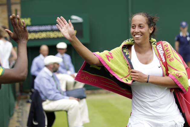 Madison Keys of the United States celebrates winning the match against Olga Govortsova of Belarus  during their singles match at the All England Lawn Tennis Championships in Wimbledon, London, Monday July 6, 2015. Keys won3-6, 6-4, 6-1.(AP Photo/Pavel Golovkin)