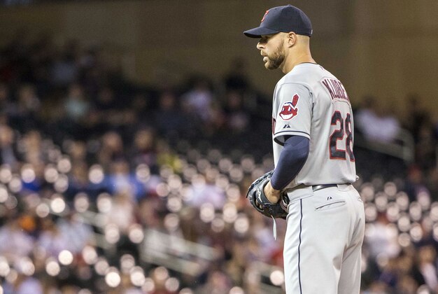 Apr 17, 2015; Minneapolis, MN, USA; Cleveland Indians starting pitcher Corey Kluber (28) stands on the mound before delivering a pitch in the fourth inning against the Minnesota Twins at Target Field. Mandatory Credit: Jesse Johnson-USA TODAY Sports