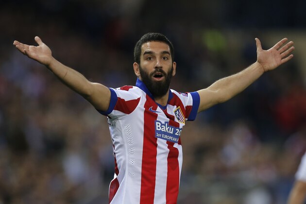 Atletico's Arda Turan reacts during the Champions League quarterfinal first leg soccer match between Atletico Madrid and Real Madrid at the Vicente Calderon stadium in Madrid, Spain, Tuesday, April 14, 2015. (AP Photo/Andres Kudacki)