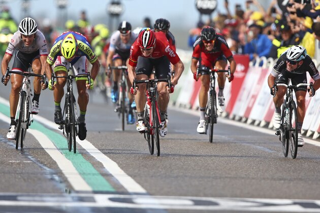 Germany's Andre Greipel, center, crosses the finish line ahead of Peter Sagan of Slovakia, second left and second place, Switzerland's Fabian Cancellara, left and third place, and Britain's sprinter Mark Cavendish, right and fourth place, to win the second stage of the Tour de France cycling race over 166 kilometers (103 miles) with start in Utrecht and finish in Neeltje Jans, Netherlands, Sunday, July 5, 2015. (AP Photo/Peter Dejong)