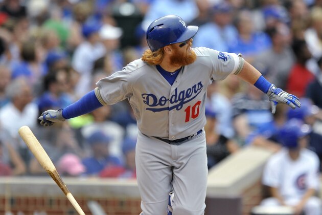 Los Angeles Dodgers' Justin Turner watches his triple during the seventh inning of a baseball game against the Chicago Cubs on Thursday, June 25, 2015, in Chicago. Los Angeles won 4-0. (AP Photo/Paul Beaty)