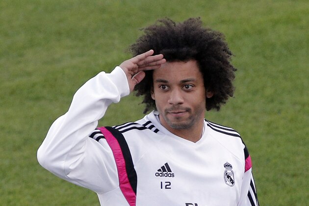 Real Madrid’s Marcelo waves fans during a training session at the Club World Cup soccer tournament in Rabat, Morocco, Monday, Dec. 15, 2014. Real Madrid will play against Cruz Azul during their semi finsl game in Marrakech on Tuesday., Dec. 16.  (AP Photo/Christophe Ena)