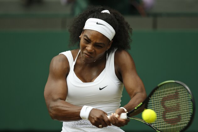 Serena Williams of the United States makes a return to Venus Williams of the United States,  during their singles match against at the All England Lawn Tennis Championships in Wimbledon, London, Monday July 6, 2015. (AP Photo/Alastair Grant)