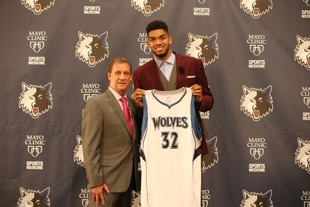 MINNEAPOLIS, MN - June 26:  2015 NBA Overall #1 draft pick Karl-Anthony Towns of the Minnesota Timberwolves is introduced to the media by President of Basketball Operations and Head Coach Flip Saunders on June 26, 2015 at the Minnesota Timberwolves and Lynx Courts at Mayo Clinic Square in Minneapolis, Minnesota.  NOTE TO USER:  User expressly acknowledges and agrees that, by downloading and or using this Photograph, user is consenting to the terms and conditions of the Getty Images License Agreement. Mandatory Copyright Notice: Copyright 2015 NBAE (Photo by David Sherman/NBAE via Getty Images)