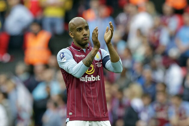 Aston Villa’s Fabian Delph applauds spectators after the English FA Cup final soccer match between Aston Villa and Arsenal at Wembley stadium in London, Saturday, May  30, 2015. Arsenal won the match 4-0. (AP Photo/Alastair Grant)