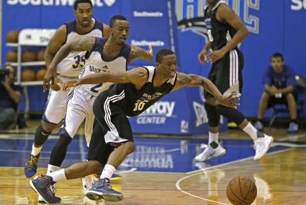 Orlando Magic Blue's Jordan Sibert, front center, goes after a loose ball in front of Memphis Grizzlies'  Russ Smith (2) as Darnell Lazare (35) looks on during the second half of an NBA summer league basketball game, Tuesday, July 7, 2015, in Orlando, Fla. (AP Photo/John Raoux)