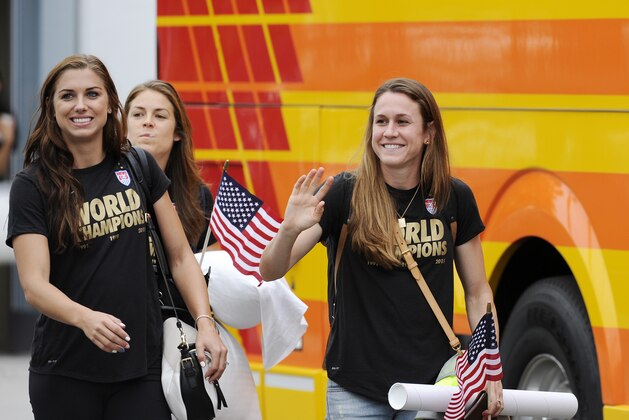 LOS ANGELES, CA - JULY 6: Alex Morgan (L) and Heather O'Reilly (R) of the U.S. Women's national team arrives at Los Angeles International Airport after winning the FIFA Women's World Cup July 6, 2015 in Los Angeles, California.  (Photo by Kevork Djansezian/Getty Images)