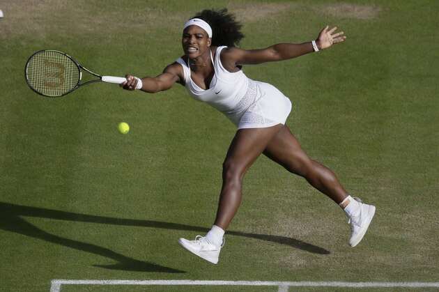 Serena Williams of the United States makes a return to Victoria Azarenka of Belarus  during their singles match at the All England Lawn Tennis Championships in Wimbledon, London, Tuesday July 7, 2015. (AP Photo/Tim Ireland)
