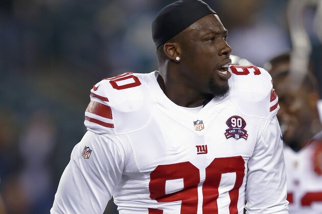 New York Giants defensive end Jason Pierre-Paul (90) talks to teammates prior to an NFL football game against the Philadelphia Eagles, Sunday, Oct. 12, 2014, in Philadelphia. (AP Photo/Matt Rourke) New York Giants defensive end Jason Pierre-Paul (90) talks to teammates prior to an NFL football game against the Philadelphia Eagles, Sunday, Oct. 12, 2014, in Philadelphia. (AP Photo/Matt Rourke)