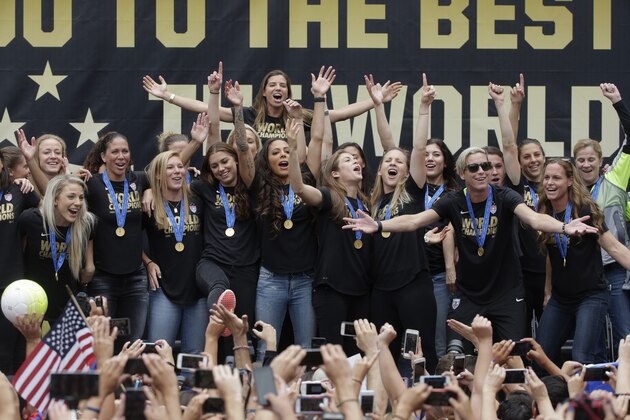 Members of the U.S. women's soccer team celebrate the team's World Cup championship during a public celebration, Tuesday, July 7, 2015, in Los Angeles. This was the first U.S. stop for the team since beating Japan in the Women's World Cup final Sunday in Canada. (AP Photo/Jae C. Hong)
