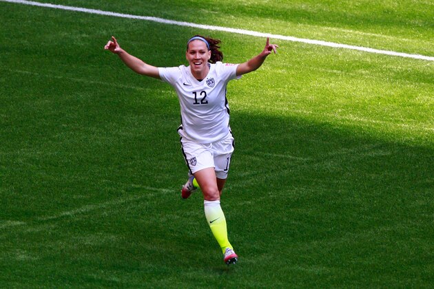VANCOUVER, BC - JULY 05:   Lauren Holiday #12 of the United States celebrates as she scores her first goal in the first half against Japan  in the FIFA Women's World Cup Canada 2015 Final at BC Place Stadium on July 5, 2015 in Vancouver, Canada.  (Photo by Jeff Vinnick/Getty Images)