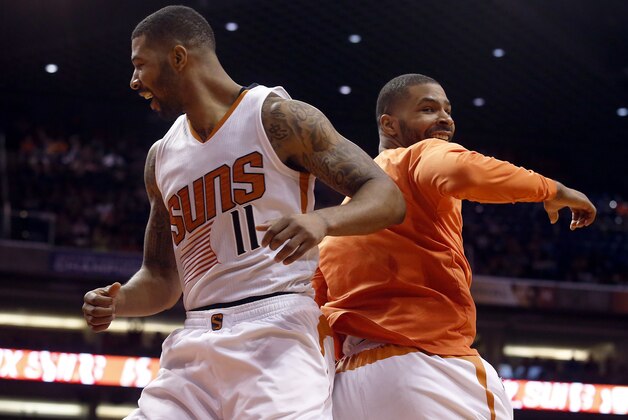 Phoenix Suns forward Markieff Morris (11) and Marcus Morris celebrate after defeating the Dallas Mavericks 98-92 during an NBA basketball game, Sunday, March 22, 2015, in Phoenix. (AP Photo/Rick Scuteri) Phoenix Suns forward Markieff Morris (11) and Marcus Morris celebrate after defeating the Dallas Mavericks 98-92 during an NBA basketball game, Sunday, March 22, 2015, in Phoenix. (AP Photo/Rick Scuteri)