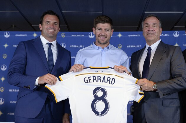 CARSON, CA - JULY 7: New Los Angeles Galaxy midfielder Steven Gerrard #8 (2nd L) poses with Chris Klein, (L)  LA Galaxy President, Bruce Arena(2nd R), LA Galaxy Head Coach and General Manager and Dan Beckerman, AEG President and CEO, after a news conference on July 7, 2015 at StubHub Center in Carson, California. The former Liverpool captain Steven Gerrard is scheduled to play his first MLS match on Friday, July 17 at StubHub Center against San Jose Earthquakes. (Photo by Kevork Djansezian/Getty Images)