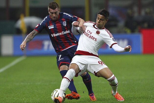 MILAN, ITALY - NOVEMBER 05:  Julio Alberto Buffarini of San Lorenzo competes for the ball with Hachim Mastour of AC Milan during Luigi Berlusconi Trophy at Stadio Giuseppe Meazza on November 5, 2014 in Milan, Italy.  (Photo by Marco Luzzani/Getty Images)