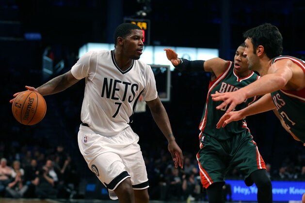 Mar 20, 2015; Brooklyn, NY, USA; Brooklyn Nets forward Joe Johnson (7) defended by Milwaukee Bucks center Zaza Pachulia (27) during the second half at the Barclays Center. The Nets defeated the Bucks 129 - 127 in three overtimes. Mandatory Credit: Adam Hunger-USA TODAY Sports