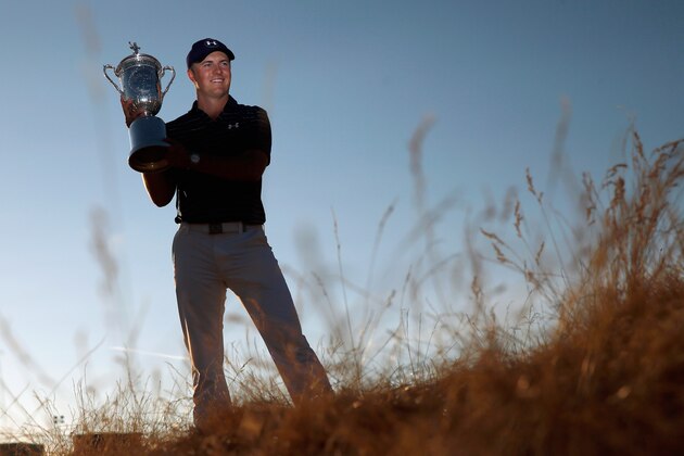 UNIVERSITY PLACE, WA - JUNE 21:  Jordan Spieth of the United States poses with the trophy for photographers after winning the 115th U.S. Open Championship at Chambers Bay on June 21, 2015 in University Place, Washington.  (Photo by Ezra Shaw/Getty Images)
