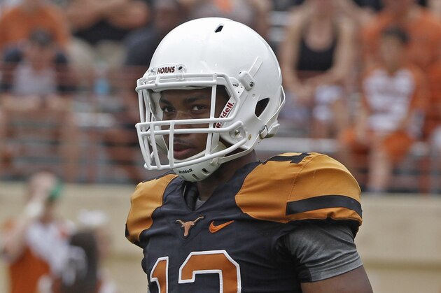 Texas quarterback Jerrod Heard looks on during the first quarter of Texas' Orange and White spring NCAA college football game, Saturday, April 18, 2015, in Austin, Texas. (AP Photo/Michael Thomas)