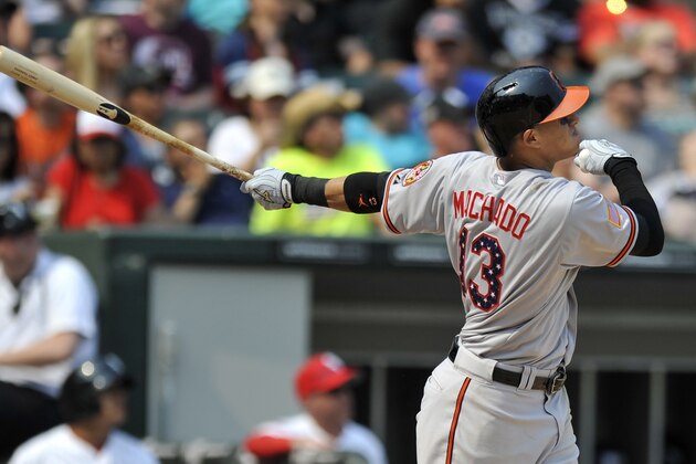 Baltimore Orioles' Manny Machado (13) watches his two-run home run during the eighth inning of a baseball game against the Chicago White Sox Saturday, July 4, 2015, in Chicago. Chicago won 3-2. (AP Photo/Paul Beaty)