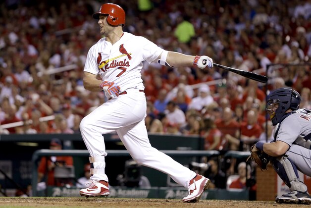 St. Louis Cardinals' Matt Holliday follows through on a double during the fifth inning of a baseball game against the Detroit Tigers Sunday, May 17, 2015, in St. Louis. (AP Photo/Jeff Roberson)