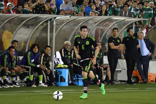 Mar 28, 2015; Los Angeles, CA, USA; Mexico midfielder Hector Herrera (6) controls the ball against Ecuador during the second half at Los Angeles Memorial Coliseum. Mandatory Credit: Jake Roth-USA TODAY Sports Mar 28, 2015; Los Angeles, CA, USA; Mexico midfielder Hector Herrera (6) controls the ball against Ecuador during the second half at Los Angeles Memorial Coliseum. Mandatory Credit: Jake Roth-USA TODAY Sports