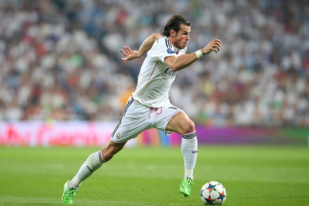 MADRID, SPAIN - MAY 13:  Gareth Bale of Real Madrid CF runs with the ball during the UEFA Champions League Semi Final second leg match between Real Madrid CF and Juventus at Estadio Santiago Bernabeu on May 13, 2015 in Madrid, Spain.  (Photo by Alex Livesey/Getty Images)