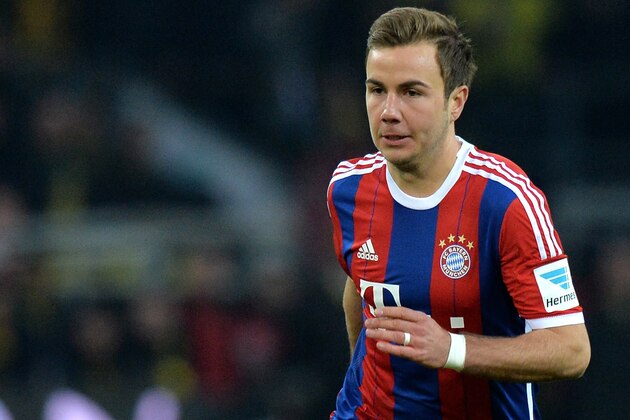 DORTMUND, GERMANY - APRIL 04:  Mario Goetze of Muenchen runs with the ball during the Bundesliga match between Borussia Dortmund and FC Bayern Muenchen at Signal Iduna Park on April 4, 2015 in Dortmund, Germany.  (Photo by Sascha Steinbach/Getty Images For MAN)