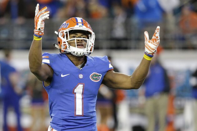 Florida defensive back Vernon Hargreaves, III (1) raises his arms to fans to cheer louder during the second half of an NCAA college football game against Georgia in Jacksonville, Fla., Saturday, Nov. 1, 2014. Florida won 38-20. (AP Photo/John Raoux)