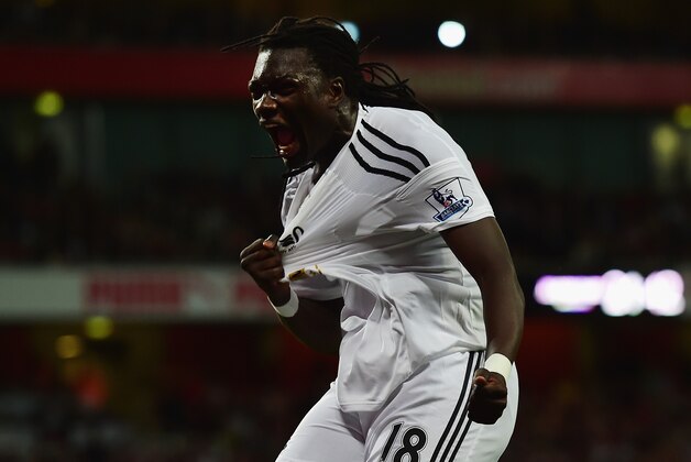 LONDON, ENGLAND - MAY 11:  Bafetimbi Gomis of Swansea City celebrates scoring the opening goal during the Barclays Premier League match between Arsenal and Swansea City at Emirates Stadium on May 11, 2015 in London, England.  (Photo by Jamie McDonald/Getty Images)