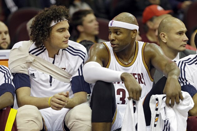 Cleveland Cavaliers' Brendan Haywood, right, talks with Anderson Varejao on the bench in the fourth quarter of a preseason exhibition basketball game against Maccabi Tel Aviv Sunday, Oct. 5, 2014, in Cleveland. (AP Photo/Mark Duncan)